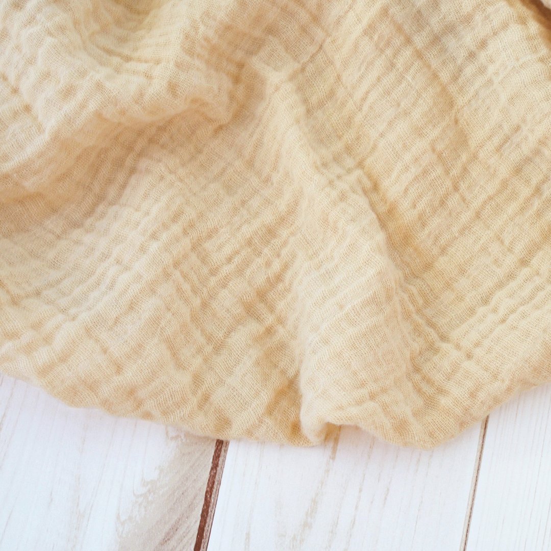 Sugar + Maple Muslin Swaddle Blanket in Sand